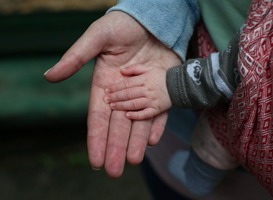 Normal_hands-of-mother-and-her-newborn-daughter-woman-is-2022-11-10-10-53-24-utc-min__1_